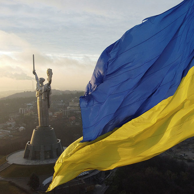 FILE PHOTO: Ukraine’s biggest national flag on the country’s highest flagpole and the giant ‘Motherland’ monument are seen at a compound of the World War II museum in Kyiv